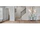 Staircase with a metal railing leading to the upper level at 1182 Chastain Dr # 8, Sugar Hill, GA 30518