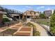 Brick walkway with landscaping and access to amphitheater at 1182 Chastain Dr # 8, Sugar Hill, GA 30518