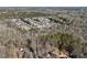 Aerial view of a suburban neighborhood with tree-lined streets at 134 Shadow Lake Sw Dr, Lilburn, GA 30047