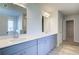 Bathroom with double vanity, grey cabinets and marble tile at 2740 Dolce Rd, Dacula, GA 30019