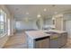 Kitchen island with farmhouse sink and stainless steel appliances at 2740 Dolce Rd, Dacula, GA 30019