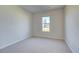 Bright bedroom with neutral walls and carpeting at 2761 Dolce Rd, Dacula, GA 30019