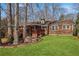 Spacious backyard featuring a wooden deck and lush lawn, perfect for outdoor enjoyment at 3660 Hickory Se Cir, Smyrna, GA 30080