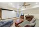 Open basement living space with a projector screen, seating area, and wood-look flooring at 3660 Hickory Se Cir, Smyrna, GA 30080