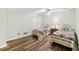 Bright bedroom with two twin beds, wood floors, and a large closet at 3660 Hickory Se Cir, Smyrna, GA 30080