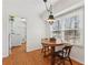 Cozy breakfast nook with a round wooden table, perfect for casual dining, next to the laundry room at 3660 Hickory Se Cir, Smyrna, GA 30080
