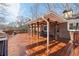 Spacious covered deck with a grill, outdoor seating, and a beautiful view at 3660 Hickory Se Cir, Smyrna, GA 30080