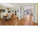 Elegant dining room with hardwood floors, crown molding, and ample natural light at 3660 Hickory Se Cir, Smyrna, GA 30080