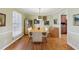 Elegant dining room with hardwood floors, stylish lighting, and ample natural light at 3660 Hickory Se Cir, Smyrna, GA 30080