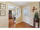 Warm entryway featuring hardwood floors, soft wall colors, and views into an office space at 3660 Hickory Se Cir, Smyrna, GA 30080