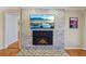 Close up of a fireplace featuring a brick facade and decorative tile flooring at 3660 Hickory Se Cir, Smyrna, GA 30080