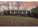 Charming single-story brick home with a manicured lawn and a picturesque sunset backdrop at 3660 Hickory Se Cir, Smyrna, GA 30080