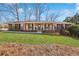 Charming brick home with a well-manicured lawn and inviting front porch at 3660 Hickory Se Cir, Smyrna, GA 30080