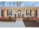 Inviting front porch featuring black shutters and space for seating and potted plants at 3660 Hickory Se Cir, Smyrna, GA 30080