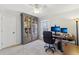 Spacious home office featuring a large bookcase, a window and a desk with monitors at 3660 Hickory Se Cir, Smyrna, GA 30080