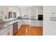 Beautiful kitchen with white cabinets, granite countertops, stainless steel appliances, and natural light at 3660 Hickory Se Cir, Smyrna, GA 30080