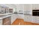 Bright, updated kitchen featuring white cabinetry, granite countertops, and stainless steel appliances at 3660 Hickory Se Cir, Smyrna, GA 30080