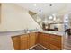 Basement kitchenette with granite countertops, wood cabinets, and modern lighting at 3660 Hickory Se Cir, Smyrna, GA 30080