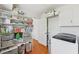 Laundry room with washer, dryer, shelving, storage and hardwood floors at 3660 Hickory Se Cir, Smyrna, GA 30080