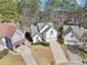 Aerial view of a two-story home with a well-manicured lawn and a two-car garage at 3812 Chalmers Ct, Clarkston, GA 30021