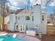 Charming blue two-story home with a sparkling pool and a spa in the fenced backyard at 3812 Chalmers Ct, Clarkston, GA 30021