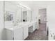 Bright bathroom with double vanity, and large mirror at 3812 Chalmers Ct, Clarkston, GA 30021