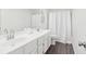 A bright bathroom with double sinks and a large mirror at 3812 Chalmers Ct, Clarkston, GA 30021