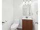 A half bathroom featuring a single vanity and toilet at 3812 Chalmers Ct, Clarkston, GA 30021