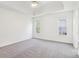 A bright bedroom with ample space and natural light from the two large windows at 3812 Chalmers Ct, Clarkston, GA 30021
