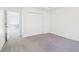 Bedroom features gray carpet, ample closet space, and an adjoining room at 3812 Chalmers Ct, Clarkston, GA 30021