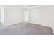 A bedroom with gray carpet, closet, and ample space at 3812 Chalmers Ct, Clarkston, GA 30021