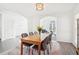 Open dining area with modern furnishings and natural light from nearby windows at 3812 Chalmers Ct, Clarkston, GA 30021