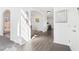Bright and open entryway featuring hardwood floors, elegant archways, and contemporary decor at 3812 Chalmers Ct, Clarkston, GA 30021