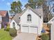 Lovely home exterior with a two-car garage, lush lawn, and a well-maintained landscape, perfect for Gathering living at 3812 Chalmers Ct, Clarkston, GA 30021