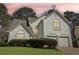 Beautiful two-story home with a well-manicured lawn and a two-car garage at 3812 Chalmers Ct, Clarkston, GA 30021