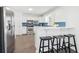 Eat-in kitchen featuring white cabinets, stainless appliances, and a breakfast bar at 3812 Chalmers Ct, Clarkston, GA 30021
