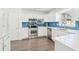 Bright kitchen with stainless steel appliances, quartz countertops, and subway tile backsplash at 3812 Chalmers Ct, Clarkston, GA 30021