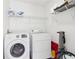 Convenient laundry room featuring a modern washer and dryer with ample storage at 3812 Chalmers Ct, Clarkston, GA 30021