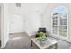 Bright living room with large arched window, cozy seating, and stylish decor, perfect for relaxation at 3812 Chalmers Ct, Clarkston, GA 30021