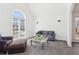 Comfortable living room featuring plush seating, carpet, and a bright window, ideal for relaxation and socializing at 3812 Chalmers Ct, Clarkston, GA 30021