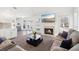 Bright living room with a fireplace, vaulted ceiling and view to the pool at 3812 Chalmers Ct, Clarkston, GA 30021