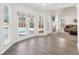 Sun-filled living room with a fireplace and French doors leading to a pool at 3812 Chalmers Ct, Clarkston, GA 30021
