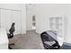 Bright office with neutral walls, closet, and shelves provides a flexible work space at 3812 Chalmers Ct, Clarkston, GA 30021