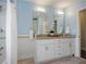 Modern bathroom featuring dual sink vanity with granite countertop and tile backsplash at 2222 Hill Nw St, Atlanta, GA 30318