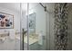 This modern bathroom features an updated shower with a rainfall showerhead and sleek vanity at 2222 Hill Nw St, Atlanta, GA 30318