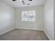 Bright bedroom with neutral carpet, ceiling fan, window allowing natural light, and neutral wall at 2222 Hill Nw St, Atlanta, GA 30318