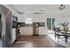 Stylish kitchen with stainless steel appliances, white cabinets and an adjacent dining area at 2222 Hill Nw St, Atlanta, GA 30318