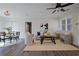 Open-concept living room with dining area featuring modern decor, hard wood floors, and ample natural light at 2222 Hill Nw St, Atlanta, GA 30318