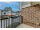 Private balcony with brick wall and view of parking lot at 3301 Henderson Mill Rd # R1, Chamblee, GA 30341