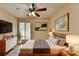 Main bedroom with large window and ceiling fan at 3301 Henderson Mill Rd # R1, Chamblee, GA 30341